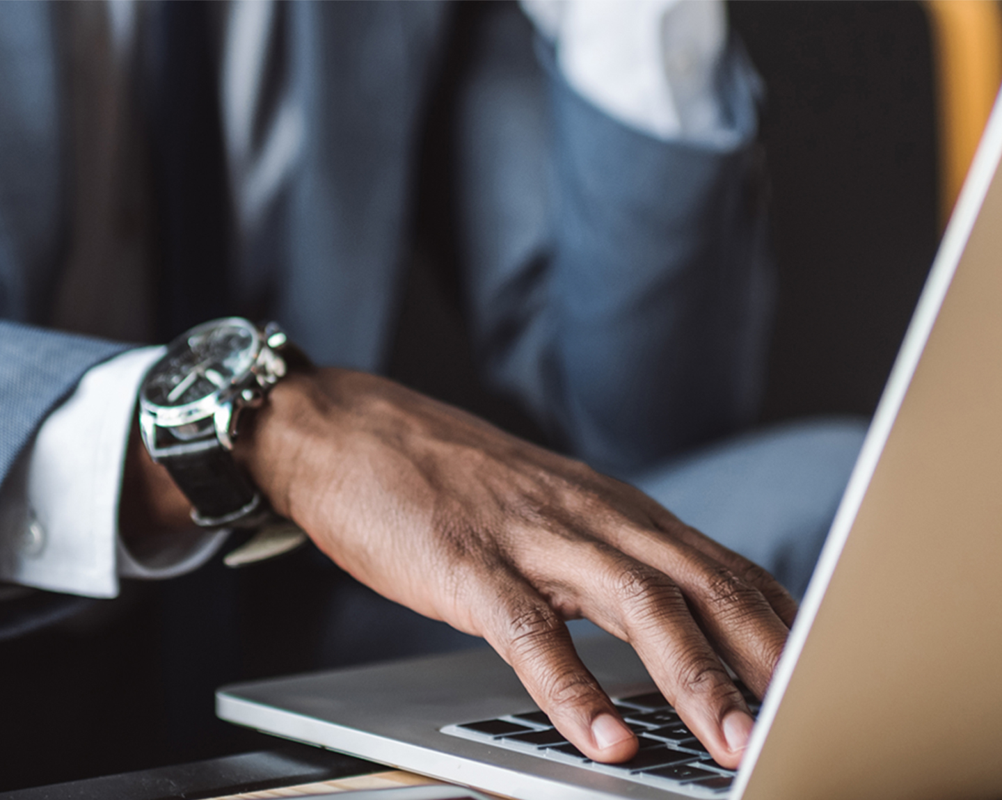 Business person works on laptop