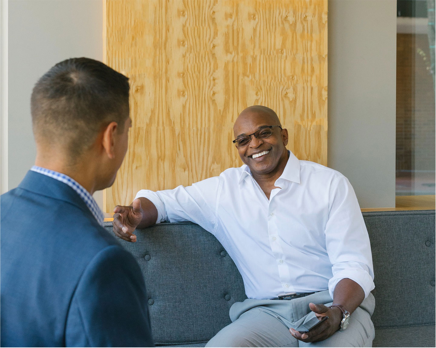 Business customer speaks with advisor in casual environment